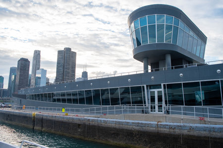 A port control tower under a bright cloudy sky