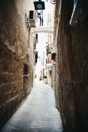A narrow alley between old buildingsの写真素材
