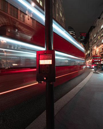 A bus trail in the City center of London nighttime with long exposureの写真素材