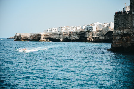 A natural view of a beautiful rocky coast in Torre Sant'Andrea, Italy in the summertimeの写真素材