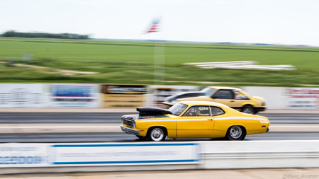 A side view of two sports cars during a drag racing in Kearney, NEの写真素材