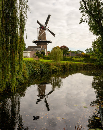 Windmill named De Nijverheid from 1857 mirrored in the waterの写真素材
