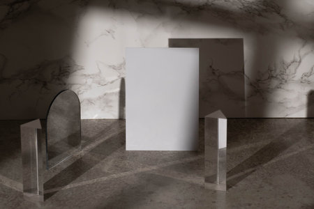 A close up of a white mockup blank on a new Stucco wall with a shadow and sunlight, ceramic flooの写真素材