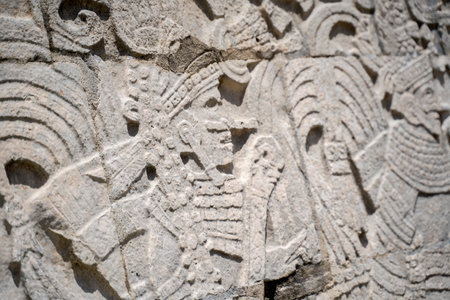 A closeup shot of carvings in Mayan ruins in Chichen Itza, Mexico