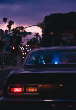 A selective of a classical car on the road in the twilightの写真素材