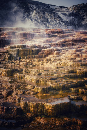 An aerial shot of the beautiful terraced pools at the Mammoth Hot Springs in Yellowstone National Parkの写真素材