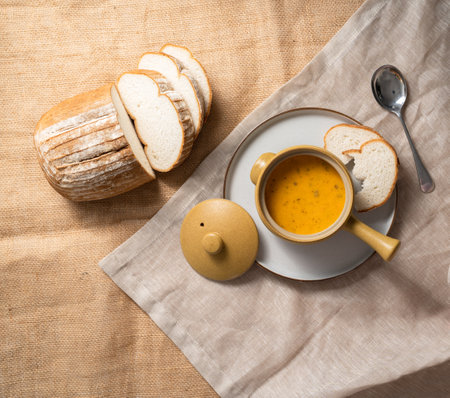 A top view of delicious pumpkin soup and breadの写真素材
