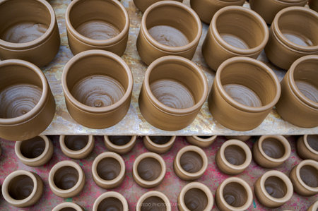 A shelf of clay pot rows