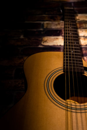 A vertical closeup shot of a guitarの写真素材