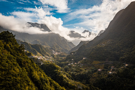 The cloudy sky over the mountains of Madeira, Portugal on a sunny dayの写真素材