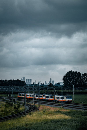 A train on the railway against a gloomy skyの写真素材