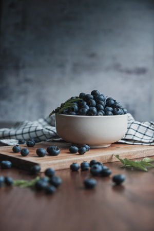 A vertical shot of ripe blueberries on a tableの写真素材