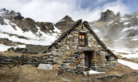 A beautiful shot of a village in a forest under the cloudy skiesの写真素材