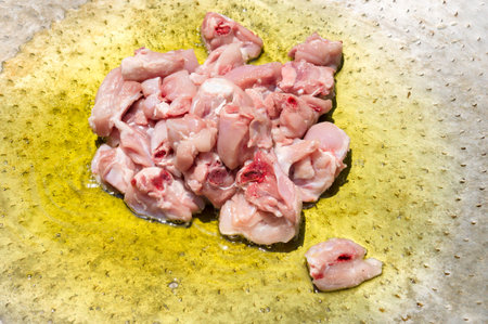 A Top view of a chicken pieces in pot for cooking paella, typical Spanish foodの写真素材