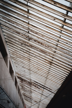 A vertical shot of the iron roof of the buildingの写真素材