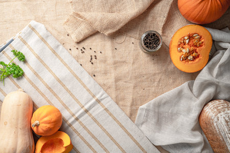 A top view of the ingredients fordelicious pumpkin soup and breadの写真素材