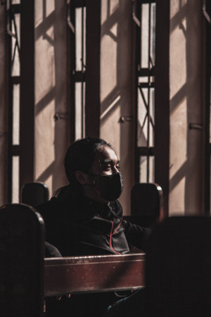 A vertical shot of a man with a black maskの写真素材