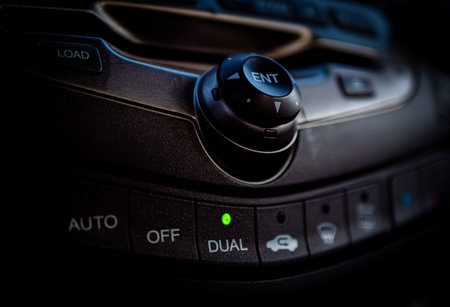 A closeup shot of temperature control dials in a motor vehicleの写真素材