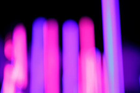 A closeup shot of neon lights isolated on a black backgroundの写真素材