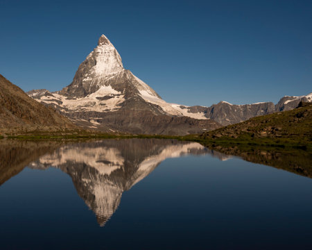 The famous Matterhorn mountain with the reflection on the lakeの写真素材