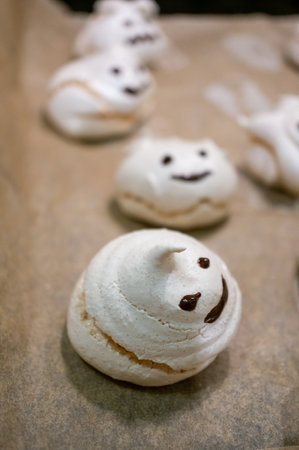 A vertical shot of meringues with a funny faceの写真素材