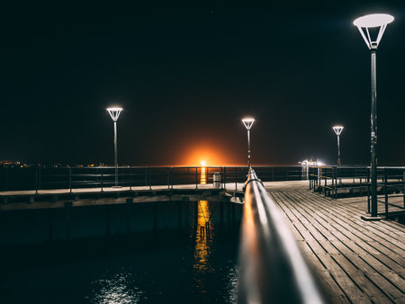 A bridge over the sea at night in Limassol, Cyprusの写真素材