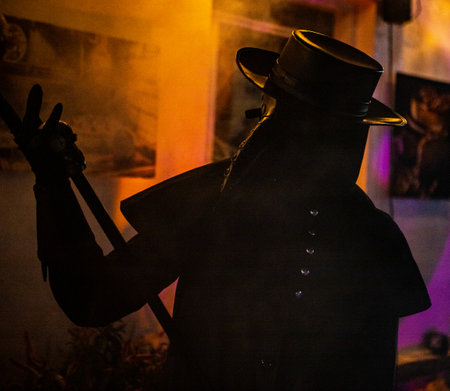 A scary plague doctor with mask and hatの写真素材