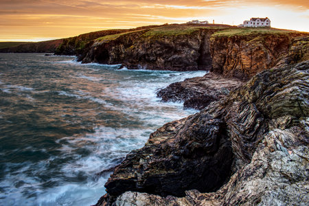 A mesmerizing view of a beautiful rocky seashore at scenic sunset