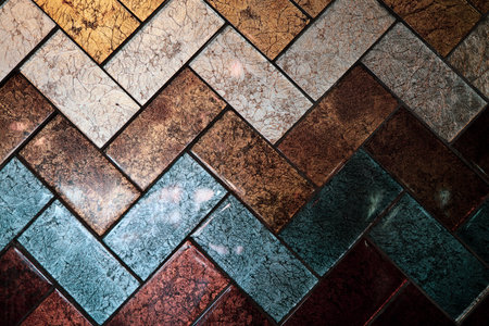 A closeup of a wall with colored tilesの写真素材