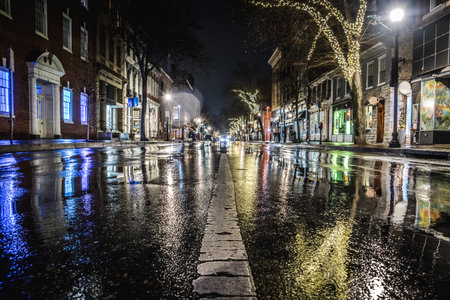 A wet street of the city after rain at nightの写真素材