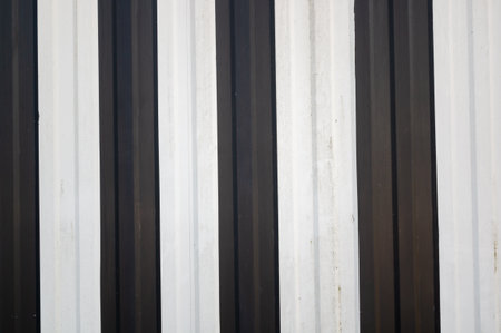 A closeup shot of black and white metal fence textureの写真素材