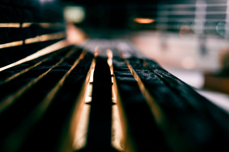 A shallow focus shot of a wooden benchの写真素材