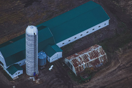 An aerial view of warehouses on a farm field in Kamouraska, Canadaの写真素材