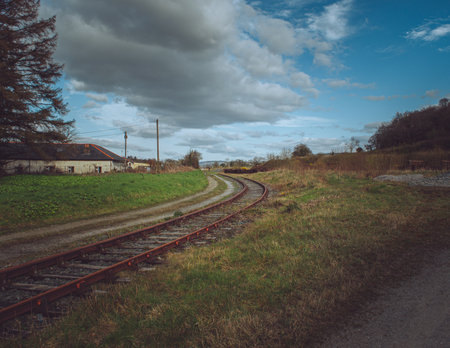 A curving railroad in the countryside on a gloomy dayの写真素材