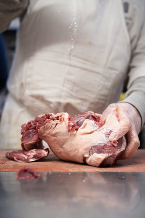 A closeup of preparing food in a store of a French traditional pork butcherの写真素材