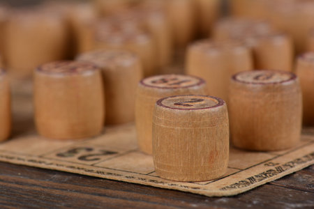 The wooden kegs and cards of a vintage lotto board gameの写真素材