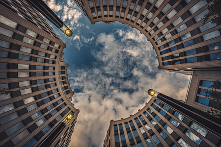 A low angle shot of Potsdamer Platz under a cloudy sky in Berlin, Germanyの写真素材