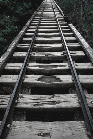 A vertical shot of a railway with old wooden sleepers, Oahu, Hawaiiの写真素材