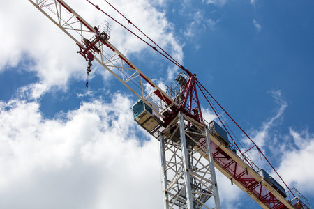 A low angle shot of a construction crane under the daylight skyの写真素材