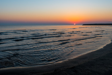 A beautiful sunrise over the sea in summerの写真素材