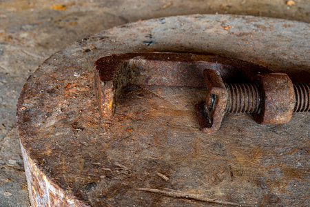 An antique work tool - hitch on a rusty surfaceの写真素材