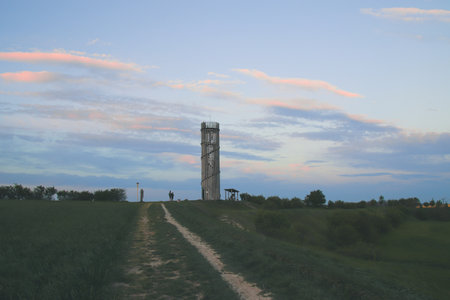 A view to the lookout tower and surrounding landscape in evening sun near Zidlochovice, Czech republicの写真素材