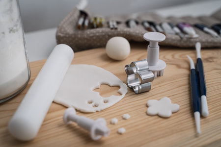 A lump of flower-shaped polymer clay on a tableの写真素材