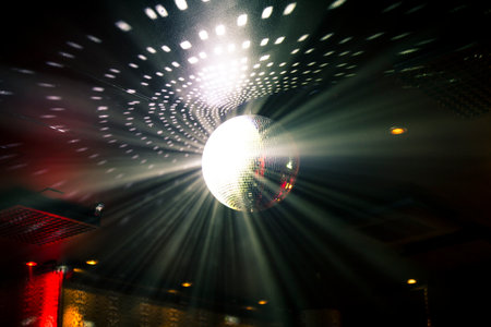 The shining disco ball hanging from the ceiling.の写真素材