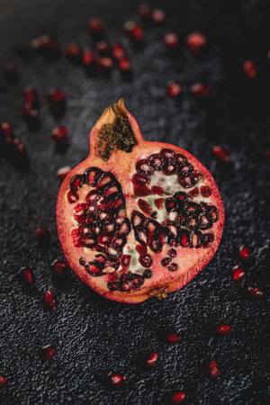 A vertical closeup of sliced pomegranate.の写真素材