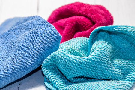 A closeup shot of bath towels on a white surface