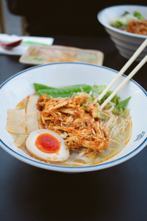 The delicious Tonkotsu ramen served on a bowl with chopsticksの写真素材