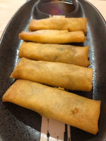 A closeup of crispy fry lumpia spring rolls