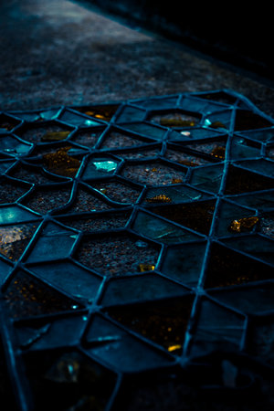 A vertical shot of broken glass on the groundの写真素材