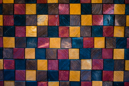 A colourful wall made out of wooden cubes. Perfect for wallpaper.の写真素材